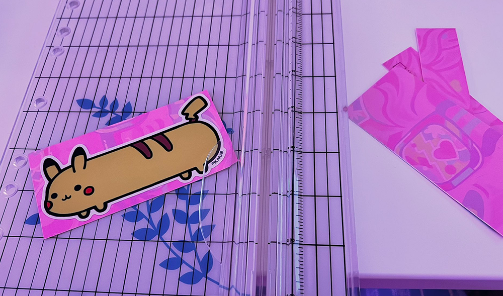 Sticker on a paper cutter, with remains on the side